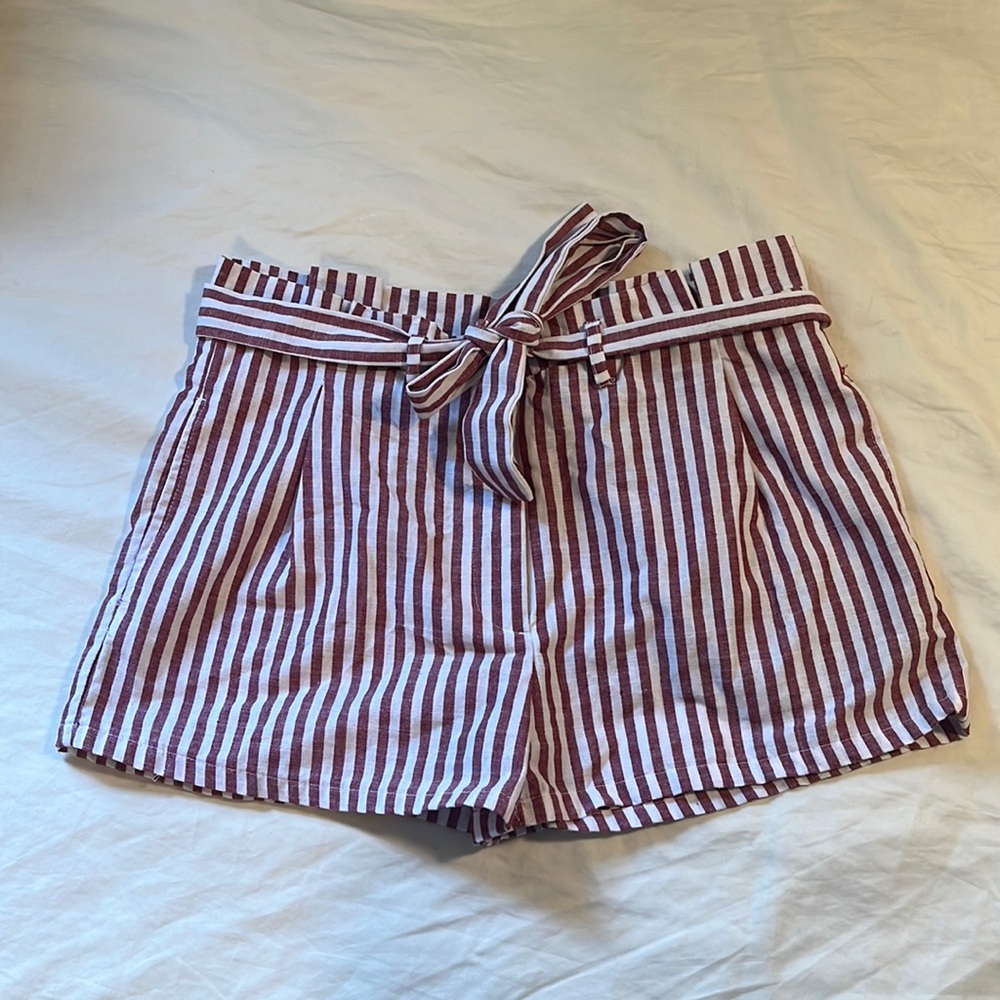 Barely worn pinstripe shorts. Color in person is closest to picture with tag.